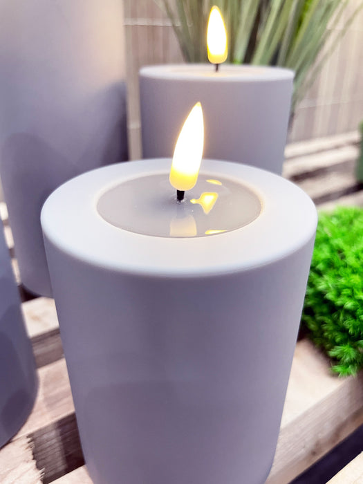 Real Flame 3D LED Stumpenkerze 10x10cm Lila Echtwachs flackernde Kerze