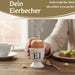 KI-generiertes Bild,Eierbecher Echt-Gold Spruch "Weich Ei" Gute Laune Eierhalter