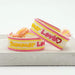 Canvas Statement Armband Summer Lovin Gelb Pink Quasten besticktes Webarmband