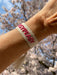 KI-generiertes Bild,Canvas Statement Armband EasyPeasy Creme Pink Quasten besticktes Webarmband