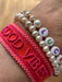 Canvas Statement Armband Good Vibes Rot Quasten besticktes Webarmband
