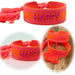 KI-generiertes Bild Canvas Statement Armband Happy Neon Orange Pink Quasten besticktes Webarmband