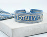 Canvas Statement Armband Totally Can Blau Silber Quasten besticktes Webarmband