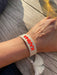 Canvas Statement Armband Karma Beige Neon Quasten besticktes Webarmband