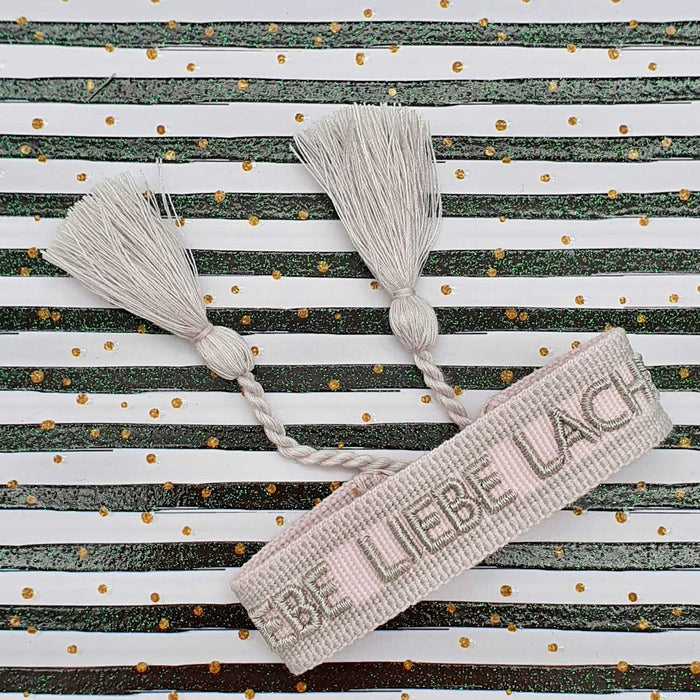 Canvas Statement Armband Lebe Liebe Lache Rosa Quasten besticktes Webarmband