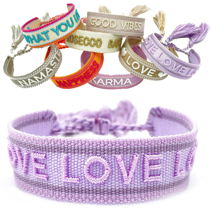 KI-generiertes Bild Canvas Statement Armband Love Lila Flieder Quasten besticktes Webarmband