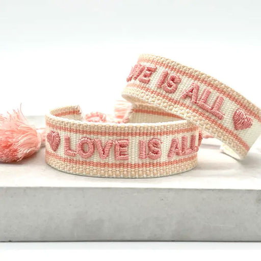 Canvas Statement Armband Love is All Rosy Peach Quasten besticktes Webarmband