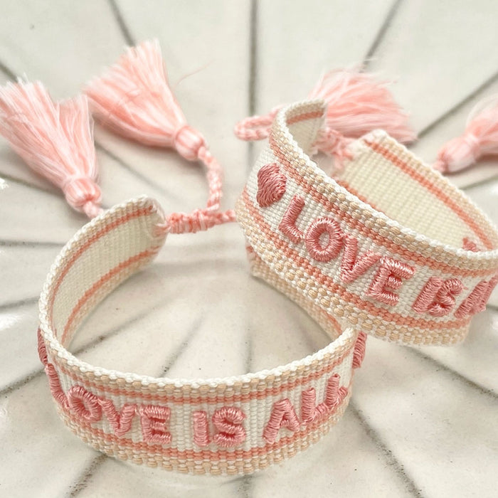 Canvas Statement Armband Love is All Rosy Peach Quasten besticktes Webarmband