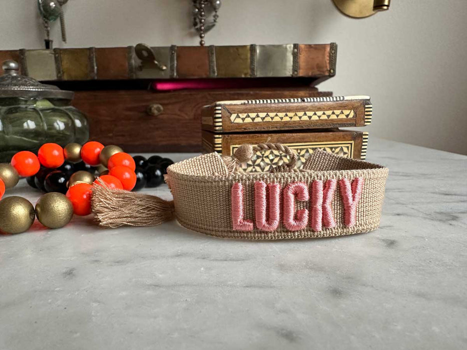 Canvas Statement Armband Lucky Beige Rosa Quasten besticktes Webarmband