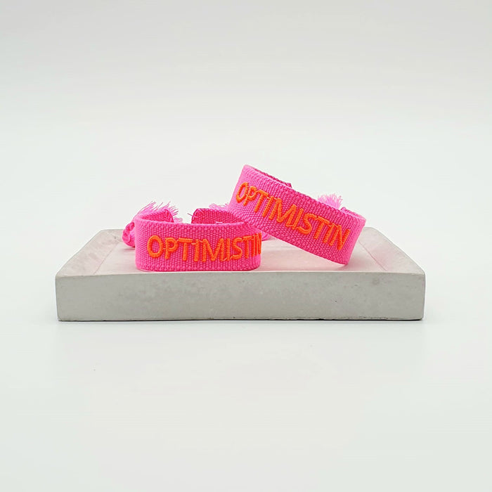 Canvas Statement Armband Optimistin Neon Pink Orange Quasten besticktes Webarmband