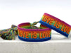 Canvas Statement Armband Love is Love Regenbogen Quasten besticktes Webarmband