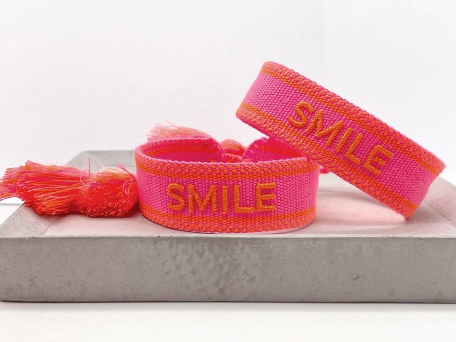 Canvas Statement Armband Smile Neon Pink Orange Quasten besticktes Webarmband